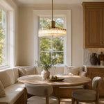 Low-Profile Marble Drum Pendant displayed in a furnished interior