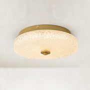 Illuminated low-profile textured glass flush mount shown from below