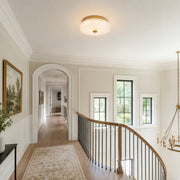Low-profile textured glass flush mount at an upper landing