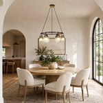 Ring chandelier with ribbed glass shades, arched doorway dining room.