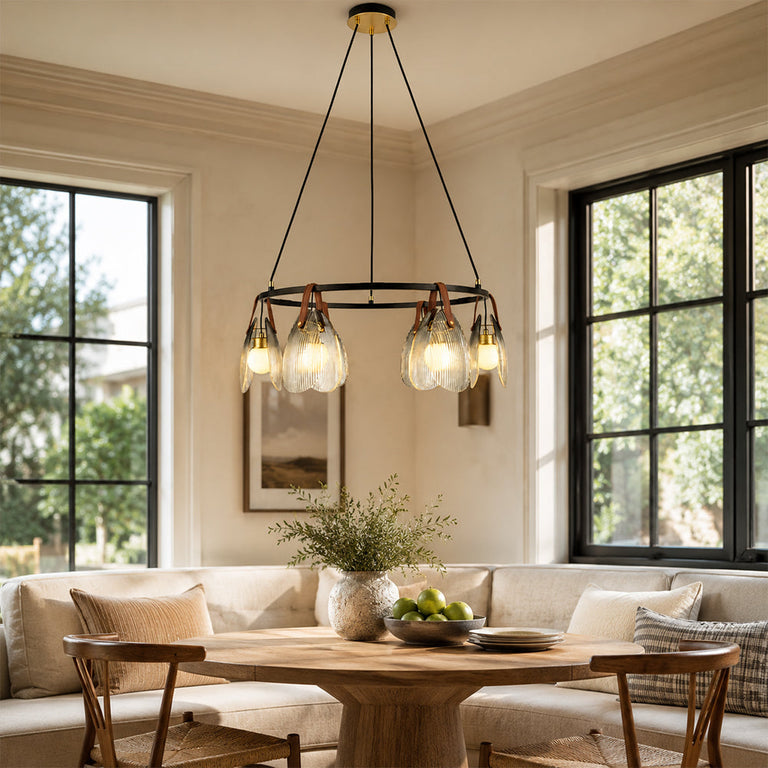 Ring chandelier with ribbed glass shades, window-corner dining setting.