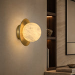 Eclipse Orb Curved Brass Disc Alabaster Wall Sconce by Dalmivik, product or room detail view