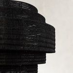 Black woven drum chandelier fixture detail.