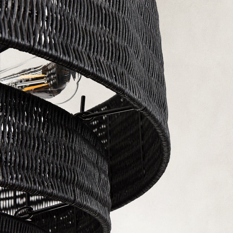 Black woven drum chandelier fixture detail.