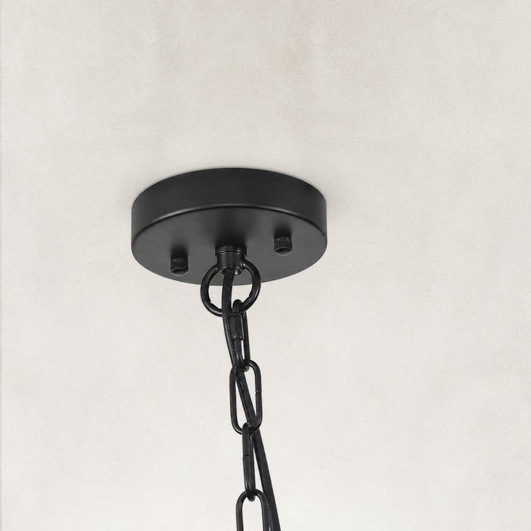 Black woven drum chandelier fixture detail.