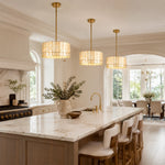Scalloped single-tier drum pendants beside arched dining opening