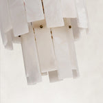 Close view of white panels and gold-tone fixing heads.