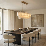 Matching complete elongated two-tier fixture over dark dining table