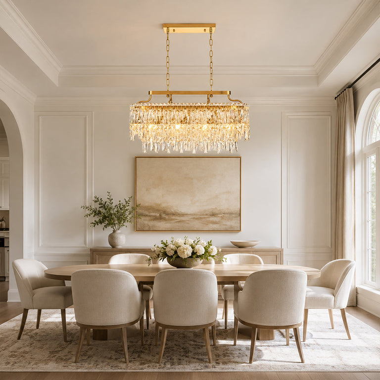 Gold-tone oval crystal chandelier, bright dining room.