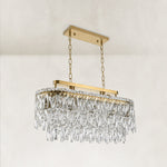 Gold-tone oval crystal chandelier, complete unlit angled fixture.