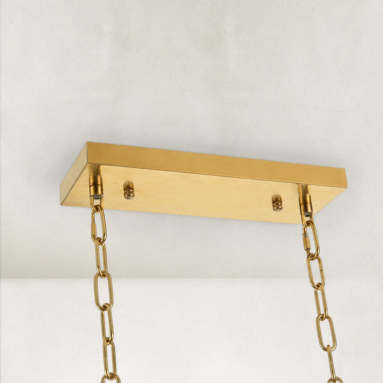 Gold-tone oval crystal chandelier, rectangular canopy and chains.