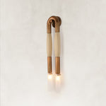 Off-white textured U-shaped wall sconce with two downward-facing ends