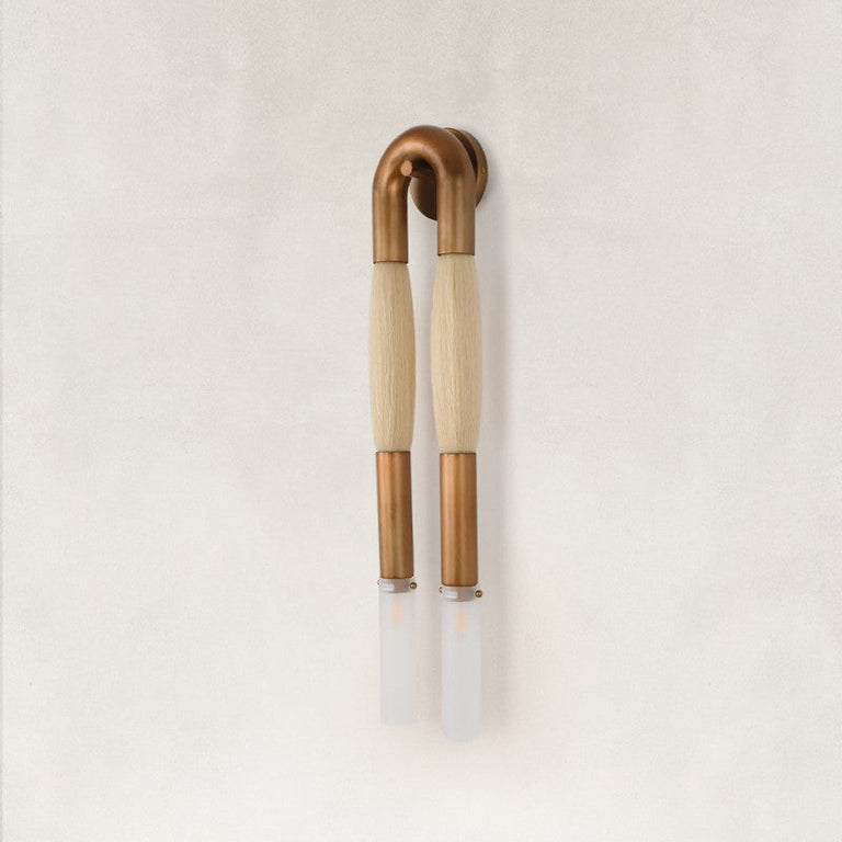 Unlit off-white U-shaped wall sconce with frosted tubes.