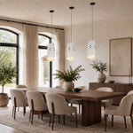Offset White Marble Blade Pendant installed above a dining table