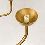 Gold-tone glass chandelier, eight-light empty holder.