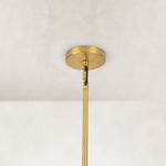 Gold-tone glass chandelier, six-light canopy and stem.
