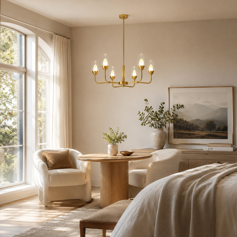 Gold-tone six-light chandelier with clear glass shades above a round table.