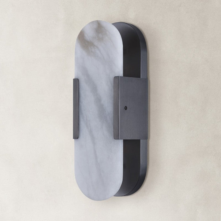 Unlit oval alabaster wall sconce with black hardware.
