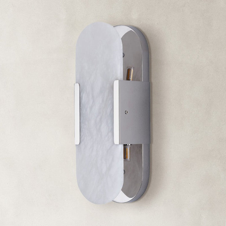 Unlit oval alabaster wall sconce with silver-tone hardware.