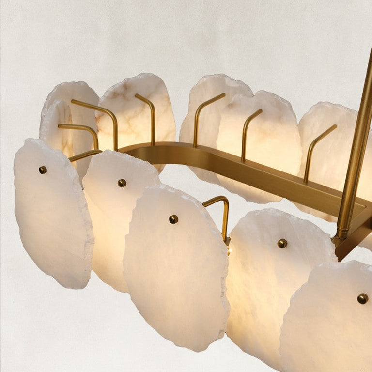 Illuminated petal panels and brass-tone oval frame.