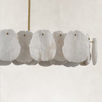 Unlit petal panels and brass-tone fasteners.
