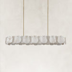 Unlit brass-tone oval petal chandelier.