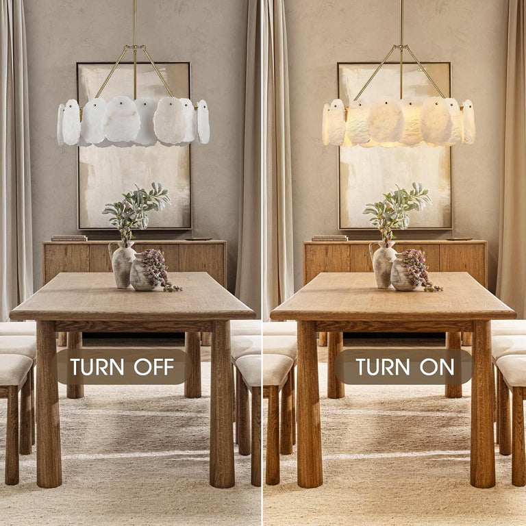 Brass-tone petal chandelier illuminated and unlit above a table.