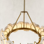 Brass-tone chandelier support arms and inner ring.