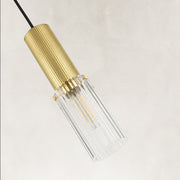 Ribbed clear glass detail on the brass mini pendant