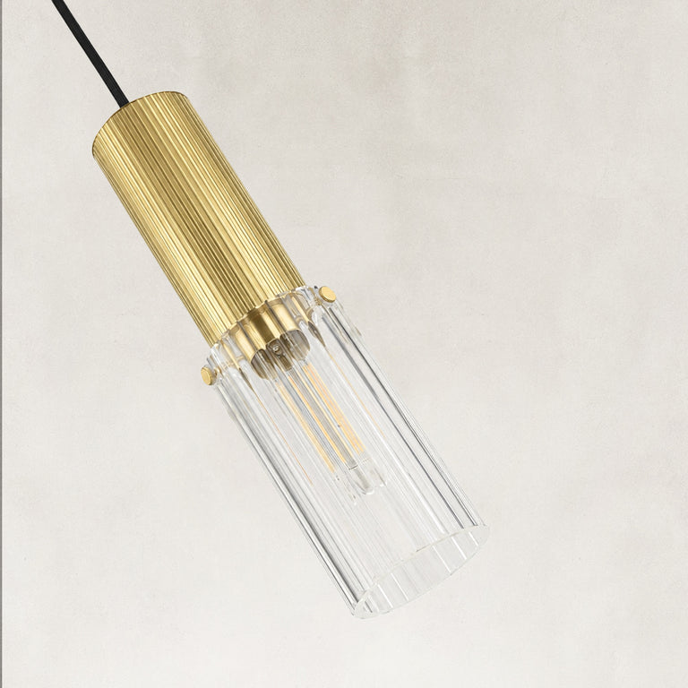 Ribbed clear glass detail on the brass mini pendant