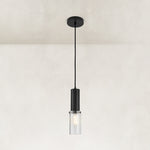 Matte-black ribbed glass cylinder mini pendant shown as a complete fixture