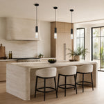 Matte-black ribbed glass mini pendant above a kitchen counter
