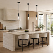 Matte-black ribbed glass mini pendant above a kitchen counter