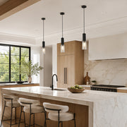 Matte-black ribbed glass mini pendants over a kitchen island