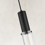 Ribbed clear glass detail on the matte-black mini pendant