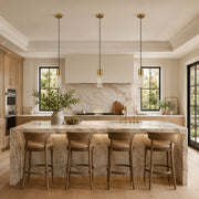 Brass ringed ribbed glass mini pendants over a kitchen island
