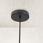 Matte-black canopy and suspension detail for the ringed mini pendant
