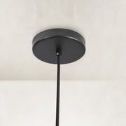 Matte-black canopy and suspension detail for the ringed mini pendant