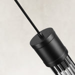 Housing detail of the matte-black ringed ribbed glass mini pendant