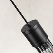 Housing detail of the matte-black ringed ribbed glass mini pendant