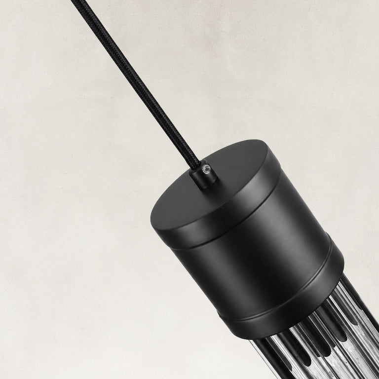Housing detail of the matte-black ringed ribbed glass mini pendant