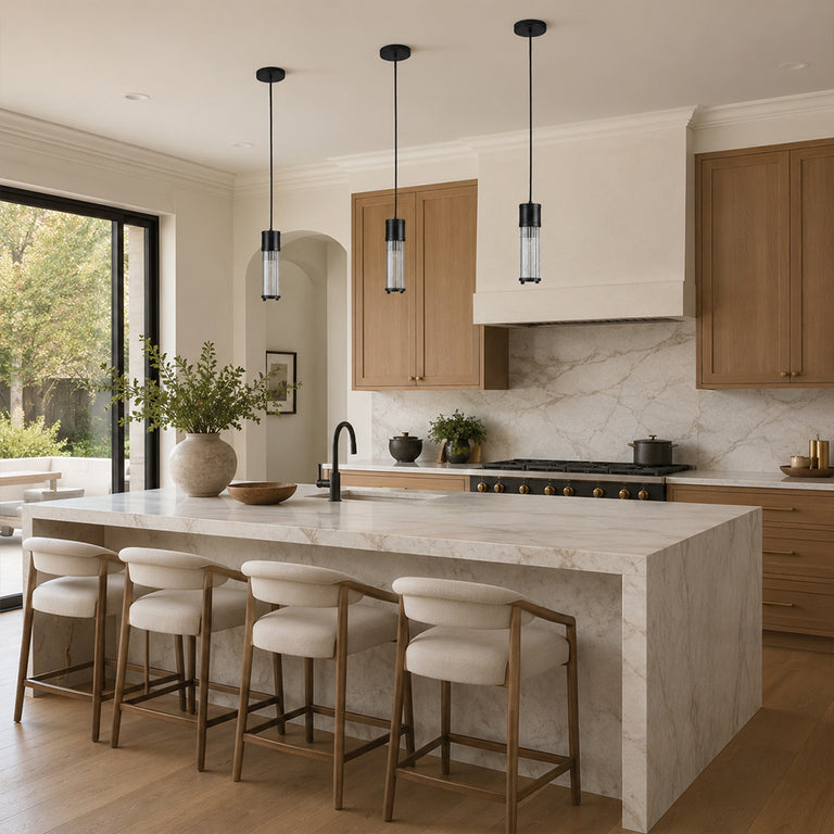 Matte-black ringed ribbed glass mini pendant above a kitchen counter