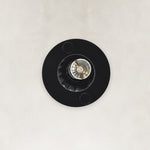 Underside detail of the matte-black ringed ribbed glass mini pendant