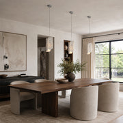 Rounded Four-Panel Marble Pendant installed above a dining table