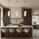 Rounded Four-Panel Marble Pendant displayed in a furnished interior