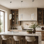 Rounded Four-Panel Marble Pendant installed above a kitchen island