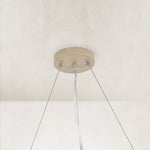 Neutral slatted ring chandelier, 24-inch canopy and cables.