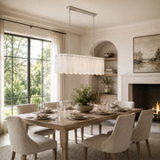 Scalloped Marble Linear Pendant installed above a dining table