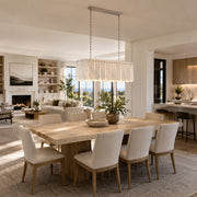 Scalloped Marble Linear Pendant installed above a dining table