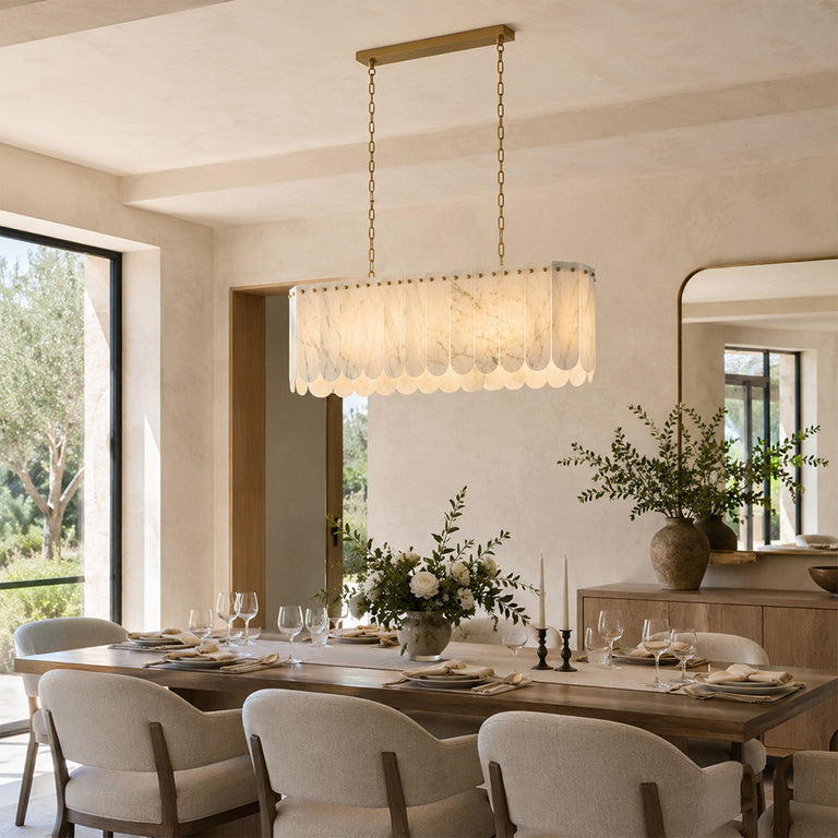 Scalloped White Marble Island Pendant displayed in a furnished interior